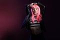 Sexy beautiful adult with pink hair wearing leather jacket Royalty Free Stock Photo