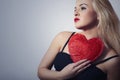 Beautiful Blond Woman with Red Heart. Beauty Girl. Show Love Symbol. Valentine's Day.Passion Royalty Free Stock Photo