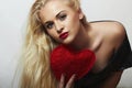 Beautiful Blond Woman with Red Heart. Beauty Girl. Show Love Symbol. Valentine's Day.Passion Royalty Free Stock Photo