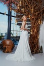 Sexy beautiful blonde woman pretty bride wedding big day marriage ceremony in summer garden wearing long silk and lace white dress Royalty Free Stock Photo