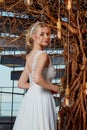 Sexy beautiful blonde woman pretty bride wedding big day marriage ceremony in summer garden wearing long silk and lace white dress Royalty Free Stock Photo