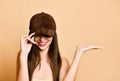 Sexy beautiful brunette woman in a brown suede baseball cap Royalty Free Stock Photo