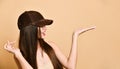 Sexy beautiful brunette woman in a brown suede baseball cap Royalty Free Stock Photo