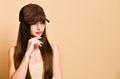 Sexy beautiful brunette woman in a brown suede baseball cap Royalty Free Stock Photo