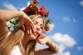 Beautiful Girl in marigold wreath with raised Royalty Free Stock Photo