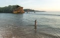 Sexy beautiful pretty european woman in bikini walking on the beach during sunset time Royalty Free Stock Photo