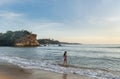 Sexy beautiful pretty woman in bikini walking on the beach during sunset time Royalty Free Stock Photo