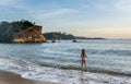 Sexy beautiful pretty woman in swimming suit standing on the beach during sunset time Royalty Free Stock Photo