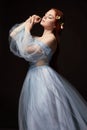 beautiful redhead girl with long hair in dress cotton retro. Woman portrait on black background. Deep eyes. Natural beauty Royalty Free Stock Photo