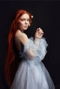 beautiful redhead girl with long hair in dress cotton retro. Woman portrait on black background. Deep eyes. Natural beauty Royalty Free Stock Photo