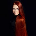 beautiful redhead girl with long hair. Perfect woman portrait on black background. Gorgeous hair and deep eyes Natural beauty