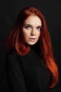 beautiful redhead girl with long hair. Perfect woman portrait on black background Gorgeous hair and deep eyes. Natural beauty