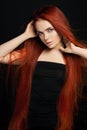 beautiful redhead girl with long hair. Perfect woman portrait on black background. Gorgeous hair and deep eyes Natural beauty Royalty Free Stock Photo