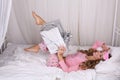 beautiful woman with blond curly hair in pajama with present Royalty Free Stock Photo