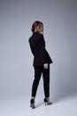 Sexy beautiful woman fashion glamour model brunette hair makeup wear black suit trousers jacket clothes office dress code casual Royalty Free Stock Photo