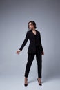 Sexy beautiful woman fashion glamour model brunette hair makeup wear black suit trousers jacket clothes office dress code casual Royalty Free Stock Photo