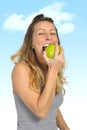 beautiful woman holding green apple fruit in healthy natural nutrition and fitness concept Royalty Free Stock Photo