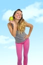 beautiful woman holding green apple fruit in healthy natural nutrition and fitness concept Royalty Free Stock Photo