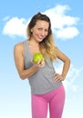 beautiful woman holding green apple fruit in healthy natural nutrition and fitness concept Royalty Free Stock Photo