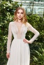Sexy beautiful woman pretty bride wedding big day marriage ceremony in summer garden wearing long silk and lace white dress bright Royalty Free Stock Photo