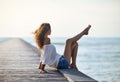 beautiful woman relaxing on pier with sea view Royalty Free Stock Photo