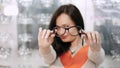 sexy beautiful woman staring at camera. Portrait of smiling female customer wearing spectacles in optical store, in an Royalty Free Stock Photo