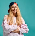 Sexy beautiful woman wearing baseball cap on blue mint Royalty Free Stock Photo