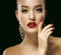 Sexy Beauty Girl with Red Lips and Nails. Luxury Woman, jewelery earrings.