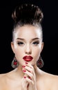 Sexy Beauty Girl with Red Lips and Nails. Luxury Woman, jewelery earrings. Fashion Brunette Portrait