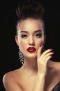 Sexy Beauty Girl with Red Lips and Nails. Luxury Woman, jewelery earrings.