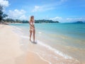 bikini body woman playful on paradise tropical beach having Royalty Free Stock Photo