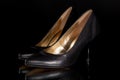 black leather woman`s classic stiletto high heel court shoe Royalty Free Stock Photo