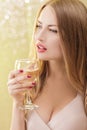 blond woman with a glass of champagne at party Royalty Free Stock Photo