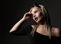 blonde beautiful woman with dreadlocks on a dark background in the studio Royalty Free Stock Photo