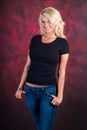 blonde girl fashion model in blue jeans Royalty Free Stock Photo