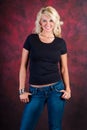 blonde girl fashion model in blue jeans Royalty Free Stock Photo