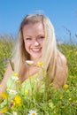 blonde on meadow with camomile Royalty Free Stock Photo