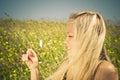 blonde on meadow with camomile Royalty Free Stock Photo