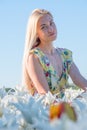 Sexy blonde at a photo shoot in a field of flowers and tulips Holland