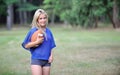 blonde woman Amercian football player Royalty Free Stock Photo