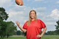 blonde woman playing American football Royalty Free Stock Photo