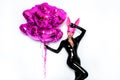 Sexy blonde woman posing in latex black costume and pink bunny mask and pink balloons on white background. Easter bunny concept. Royalty Free Stock Photo