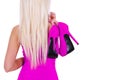 blonde young woman holding hot pink shoes isolated