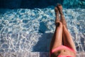 body of beautiful woman. Girl relaxing in a poll at summer. Royalty Free Stock Photo