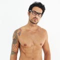 Sexy body, man with tattoo, glasses and beard or fit, muscular or healthy and shirtless beauty, fashion or style Royalty Free Stock Photo