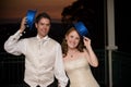 bride and young handsome groom with blue hats