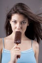 brunette eating chocolate Ice lollies Royalty Free Stock Photo