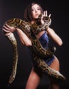 brunette holding python Royalty Free Stock Photo