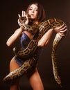 brunette holding python Royalty Free Stock Photo