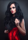 brunette in red corset fur and long hair in s